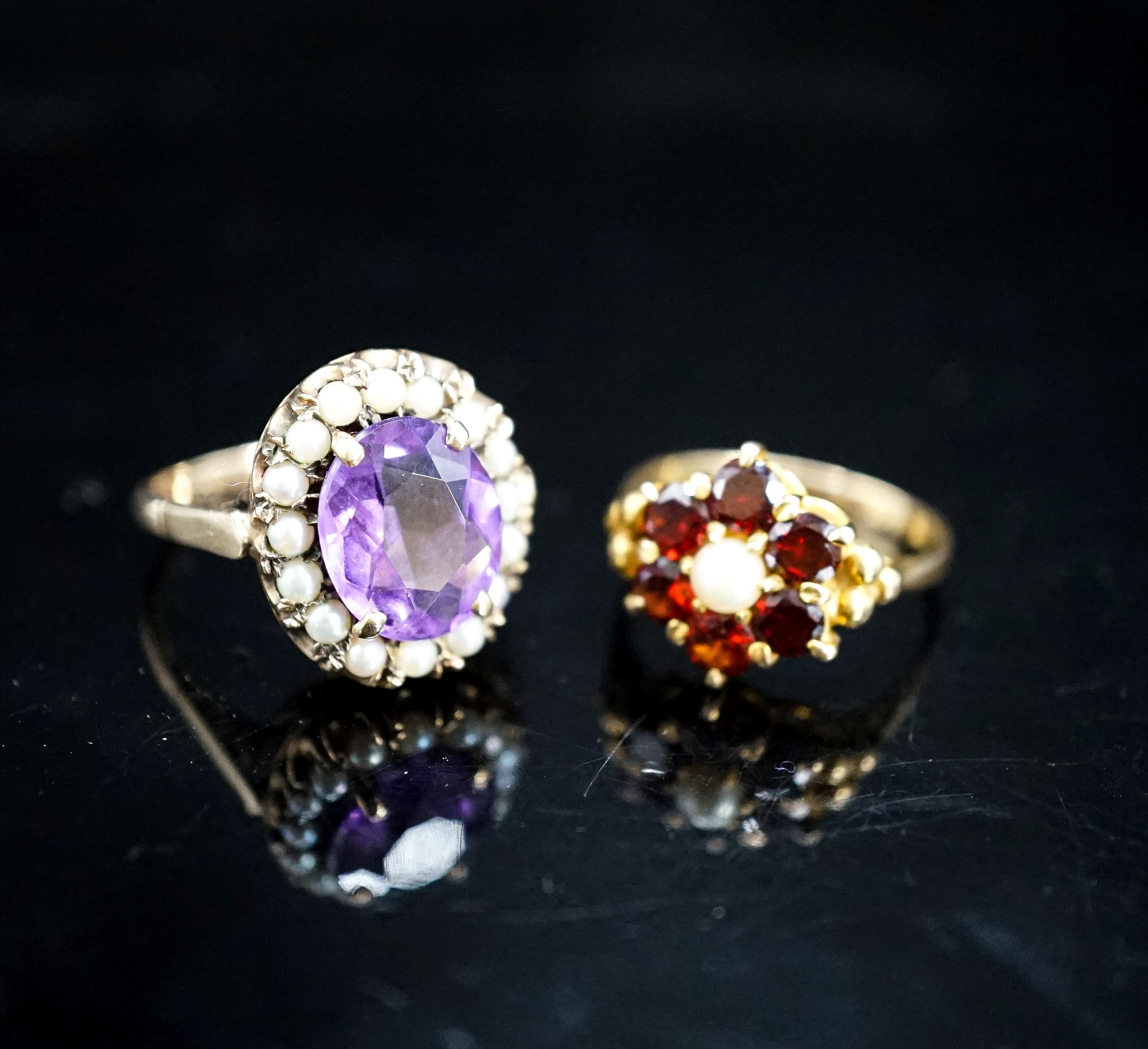 A 9ct garnet and cultured pearl ring and a 9ct gold amethyst and seed pearl mounted ring, gross 9.4 grams.